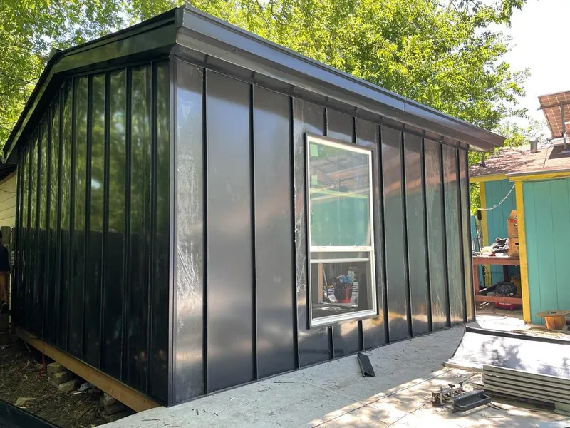 Black standing seam metal wall panels for Roof Inspection in Marvin